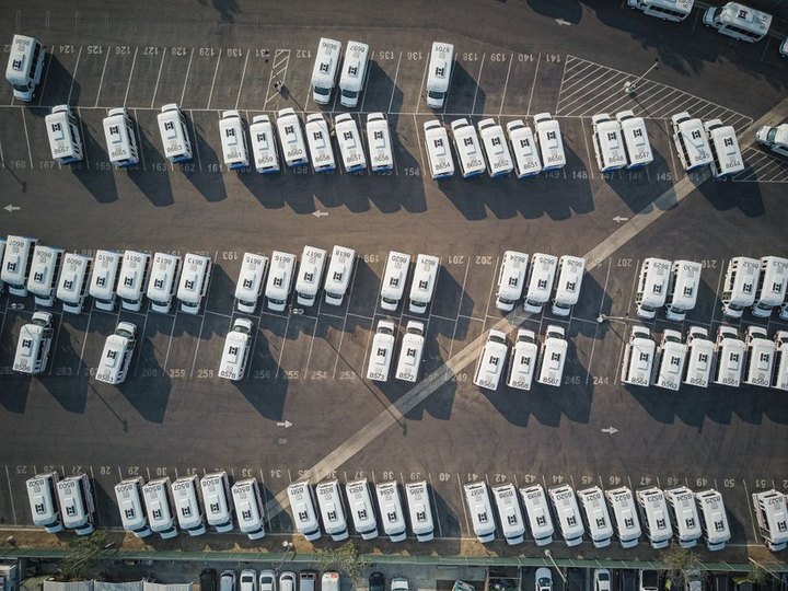 Rows of fleet vehicles parked in a depot