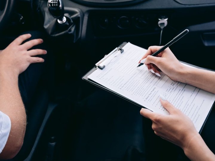 Adjuster documenting vehicle condition for an insurance claim